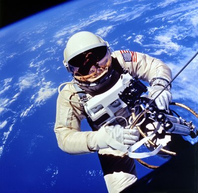 US Astronaut Edward H White II carrying out external tasks during the third orbit of Gemini-Titan 4 flight by National Aeronautics and Space Administration National Aeronautics and Space Administration